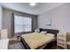 Well-lit bedroom featuring a large window, a bed, and neutral decor at 10344 Vienna St, Parker, CO 80134