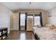 Bright bedroom with hardwood floors, closet, and windows letting in natural light at 10344 Vienna St, Parker, CO 80134