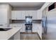 Contemporary kitchen with stainless appliances, ample counter space, and stylish backsplash at 10344 Vienna St, Parker, CO 80134