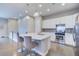 Gourmet kitchen with island seating, stainless steel appliances and modern cabinetry at 10344 Vienna St, Parker, CO 80134