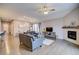 Inviting living room featuring hardwood floors, neutral paint, and a fireplace at 10344 Vienna St, Parker, CO 80134