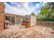 Spacious back deck features a built-in hot tub and grilling area, perfect for outdoor entertaining at 7773 Brentwood Ct, Arvada, CO 80005