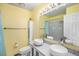 Bright bathroom with double sinks, stylish fixtures, and ample space with a mirror and storage at 7773 Brentwood Ct, Arvada, CO 80005