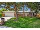 Charming ranch home with mature trees, a well-maintained lawn, and a two-car garage at 7773 Brentwood Ct, Arvada, CO 80005