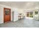 Bright garage space with convenient built-in shelving and refrigerator at 7773 Brentwood Ct, Arvada, CO 80005