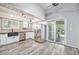 Modern kitchen featuring stainless steel appliances, sleek countertops, and ample natural light at 7773 Brentwood Ct, Arvada, CO 80005