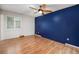 Spacious main bedroom with hardwood floors, a ceiling fan, and custom paint at 7773 Brentwood Ct, Arvada, CO 80005