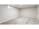 Finished basement with comfortable carpet and access to closet for storage at 423 Nile St, Aurora, CO 80010
