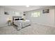 Spacious bedroom with multiple windows providing natural light and a serene atmosphere at 423 Nile St, Aurora, CO 80010