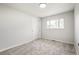 Cozy bedroom featuring neutral carpet and a double door closet at 423 Nile St, Aurora, CO 80010