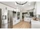 Modern kitchen boasting stainless steel appliances, white cabinets, and an open layout, perfect for entertaining at 423 Nile St, Aurora, CO 80010