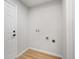 Functional laundry room with washer and dryer hookups and durable flooring at 423 Nile St, Aurora, CO 80010