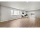 Bright living room with large window, sliding door, and neutral decor for versatile styling at 423 Nile St, Aurora, CO 80010