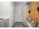 Organized mud room featuring a built-in bench with storage, coat hooks, and stylish decor at 257 Jackson St, Denver, CO 80206