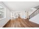 Sun-filled living room connects to a kitchen, staircase, and offers an abundance of space and light at 5614 Riverbend Ave, Firestone, CO 80504