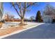 Large backyard with storage shed, partially covered in snow at 2142 Sherri Mar St, Longmont, CO 80501