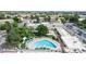 An aerial view of building complex with pool area, lush landscaping, and ample parking at 775 S Alton Way # 3D, Denver, CO 80247