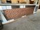 Unique bar adorned with pennies and stainless steel accents with neutral carpet below at 775 S Alton Way # 3D, Denver, CO 80247