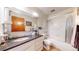 Bathroom featuring a shower with sliding glass doors, an interesting vanity, and a toilet at 775 S Alton Way # 3D, Denver, CO 80247