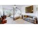 Serene bedroom featuring unique bed frame, neutral color palette, and cozy seating area at 775 S Alton Way # 3D, Denver, CO 80247
