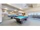 Bright billiard room features multiple pool tables and carpet at 775 S Alton Way # 3D, Denver, CO 80247