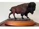 Detailed sculpture of a bison with realistic fur texture displayed on a wooden base at 775 S Alton Way # 3D, Denver, CO 80247
