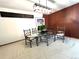 Dining room with a glass-topped table, ornate chairs, decorative lighting, and unique wall art at 775 S Alton Way # 3D, Denver, CO 80247