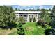 Well-maintained multi-story building with manicured lawn and mature landscaping at 775 S Alton Way # 3D, Denver, CO 80247