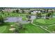 Aerial perspective of a lush golf course, highlighting water features, greens, and manicured fairways at 775 S Alton Way # 3D, Denver, CO 80247