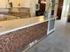 Unique kitchen island with a penny-covered facade and quartz countertop at 775 S Alton Way # 3D, Denver, CO 80247