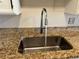 Close up of the kitchen sink with granite countertops, and stainless steel faucet at 775 S Alton Way # 3D, Denver, CO 80247