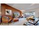 Cozy living room with comfortable seating, warm colors, tv, and sliding glass doors to patio at 775 S Alton Way # 3D, Denver, CO 80247