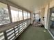 Enclosed sunroom with unique brick-like design with large windows, carpet and natural light at 775 S Alton Way # 3D, Denver, CO 80247