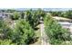 Scenic view of neighborhood walking path with mature trees and greenery at 775 S Alton Way # 3D, Denver, CO 80247