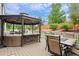 Outdoor deck with gazebo featuring comfortable seating and a dining table at 11870 Cattle Ln, Parker, CO 80134