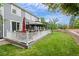 Backyard featuring a large deck with gazebo overlooking lush lawn and mature trees at 11870 Cattle Ln, Parker, CO 80134