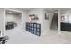 Finished basement area featuring carpet flooring, storage shelves and adjacent play area at 11870 Cattle Ln, Parker, CO 80134