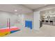 View of basement featuring play area with gymnastic equipment adjacent to finished kitchen at 11870 Cattle Ln, Parker, CO 80134