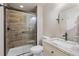 Bathroom with tiled walk-in shower, granite vanity and modern fixtures at 11870 Cattle Ln, Parker, CO 80134