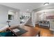 Open-concept living area with office space and staircase, perfect for entertaining guests at 11870 Cattle Ln, Parker, CO 80134