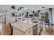 Open-concept kitchen with granite counters connects to Gathering room and backyard at 11870 Cattle Ln, Parker, CO 80134