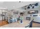 Open-concept kitchen and dining area with stainless appliances and views of the living area at 11870 Cattle Ln, Parker, CO 80134