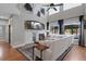 Cozy living area features a fireplace, built-ins, and large windows with backyard views at 11870 Cattle Ln, Parker, CO 80134