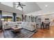 Bright open living space with hardwood floors, tall ceilings, lots of light, and gourmet kitchen at 11870 Cattle Ln, Parker, CO 80134