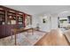 Office space with custom bookshelves and wooden desk, great for working from home at 11870 Cattle Ln, Parker, CO 80134
