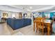 Bright dining area with a wooden table and chairs, easily seating six at 4967 S Urban Ct, Morrison, CO 80465