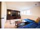 Finished basement boasting a large entertainment center, comfortable seating, and ample natural light at 9512 W Ontario Dr, Littleton, CO 80128