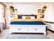 Stylish bedroom boasts a white storage bed, decor, and a colorful rug, creating a relaxing atmosphere at 9512 W Ontario Dr, Littleton, CO 80128