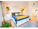 Charming bedroom features a white bed, cozy decor, and plenty of natural light for a serene retreat at 9512 W Ontario Dr, Littleton, CO 80128