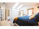 Bright bedroom features a vaulted ceiling with skylights, providing ample natural light and a spacious feel at 9512 W Ontario Dr, Littleton, CO 80128